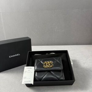 Authentic CHANEL Black Quilted Leather Pouch with Gold Logo